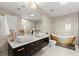 Luxury bathroom with double vanity and freestanding soaking tub at 3324 Peachtree Ne Rd # 1114, Atlanta, GA 30326