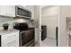 Modern kitchen features stainless steel appliances and granite countertops at 3324 Peachtree Ne Rd # 1114, Atlanta, GA 30326