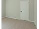 Cozy bedroom featuring neutral carpet, gray walls, and a simple white door at 459 Benson Meadows Dr, Dallas, GA 30157