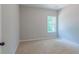 Simple bedroom with carpet and a window at 459 Benson Meadows Dr, Dallas, GA 30157