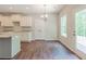 Dining area with views, modern light fixture and wood floors at 459 Benson Meadows Dr, Dallas, GA 30157