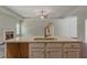 Kitchen island with granite top, double sink, and modern faucet at 459 Benson Meadows Dr, Dallas, GA 30157