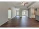 Open-concept living space with dark hardwood floors and tray ceiling at 459 Benson Meadows Dr, Dallas, GA 30157