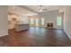 Spacious living room flows into the kitchen with a stone fireplace and wood floors at 459 Benson Meadows Dr, Dallas, GA 30157