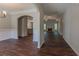 Open floor plan with a living room, dining area, kitchen, and dark wood floors at 459 Benson Meadows Dr, Dallas, GA 30157