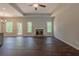 Spacious living room with fireplace, dark floors, and high ceilings at 459 Benson Meadows Dr, Dallas, GA 30157