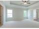 Spacious main bedroom with carpeted floors and tray ceiling at 459 Benson Meadows Dr, Dallas, GA 30157