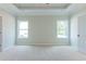 Main bedroom with neutral walls, carpet, and multiple windows at 459 Benson Meadows Dr, Dallas, GA 30157