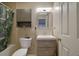 Bathroom featuring a combined shower and bath, with a neutral color palette and wooden vanity at 533 Bentley Pl, Tucker, GA 30084