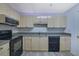 Kitchen featuring white cabinets, stainless steel appliances, and stone countertops at 533 Bentley Pl, Tucker, GA 30084