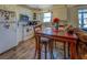 Bright kitchen with white cabinets and wood flooring at 1897 Old Loganville Rd, Loganville, GA 30052