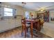 Bright eat-in kitchen, featuring white cabinets and wood-look flooring at 1897 Old Loganville Rd, Loganville, GA 30052