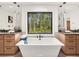 Elegant bathroom with a freestanding tub and double sinks at 200 Simonton Rd, Lawrenceville, GA 30046