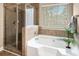 Bathroom features a shower tub combo and updated fixtures at 4860 Longview Run, Decatur, GA 30035