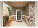 Covered front porch with stonework and a storm door at 4860 Longview Run, Decatur, GA 30035