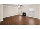 Spacious living room with hardwood floors and a fireplace at 4860 Longview Run, Decatur, GA 30035