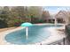 Community pool with a mushroom-shaped water feature at 4860 Longview Run, Decatur, GA 30035