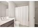 Neat bathroom with shower and dark brown vanity at 6850 Canyon Creek Way, Cumming, GA 30028