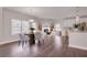 Open dining area with hardwood floors and modern table set at 6850 Canyon Creek Way, Cumming, GA 30028