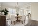 Formal dining room with a wooden table, neutral decor, and hardwood floors at 6850 Canyon Creek Way, Cumming, GA 30028