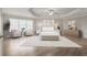 Large main bedroom with ample space and natural light at 6850 Canyon Creek Way, Cumming, GA 30028