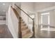 Elegant staircase with wooden railing and carpeted steps at 6850 Canyon Creek Way, Cumming, GA 30028