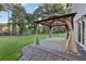 Spacious backyard patio with gazebo and stone flooring at 785 Mckenzie Sw Ct, Atlanta, GA 30311