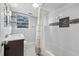 Updated bathroom, white subway tile, and bathtub shower combo at 785 Mckenzie Sw Ct, Atlanta, GA 30311