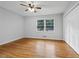 Well-lit bedroom, hardwood floors, and double door closet at 785 Mckenzie Sw Ct, Atlanta, GA 30311