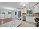 Updated kitchen, featuring white cabinets, stainless steel appliances, and an island at 785 Mckenzie Sw Ct, Atlanta, GA 30311