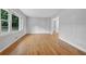 Living room with hardwood floors and large windows offering natural light at 785 Mckenzie Sw Ct, Atlanta, GA 30311