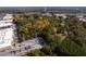 Aerial view of property with wooded area and nearby businesses at 157 New Hope Rd, Fayetteville, GA 30214
