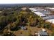 Aerial view of homes and wooded lot near shopping center at 157 New Hope Rd, Fayetteville, GA 30214