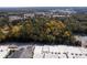 Aerial view of a wooded lot with nearby businesses at 157 New Hope Rd, Fayetteville, GA 30214