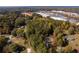 Aerial view of wooded lot near road and homes at 157 New Hope Rd, Fayetteville, GA 30214