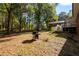 Large backyard with grill and wooded area at 157 New Hope Rd, Fayetteville, GA 30214