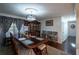 Formal dining room with a large table and hardwood floors at 157 New Hope Rd, Fayetteville, GA 30214