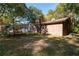 Brick home with pergola, and mature trees at 157 New Hope Rd, Fayetteville, GA 30214