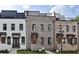 Three-unit townhome development showcasing modern brick exteriors and rooftop decks at 332 Sugarview Rd # 16, Sugar Hill, GA 30518