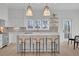 Modern kitchen with white cabinets, quartz countertops, and island seating at 332 Sugarview Rd # 16, Sugar Hill, GA 30518