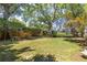 Large backyard with green grass and trees at 1441 Etowah Ne Dr, Atlanta, GA 30319