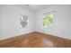 Bright bedroom with hardwood floors and large windows at 1441 Etowah Ne Dr, Atlanta, GA 30319