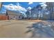 Large backyard with basketball court and trees at 2105 Rock Ct, Loganville, GA 30052
