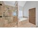 Spa-like bathroom with a large shower and soaking tub at 2105 Rock Ct, Loganville, GA 30052