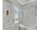 Clean bathroom with shower and white vanity at 2105 Rock Ct, Loganville, GA 30052
