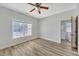 Bright bedroom with hardwood floors and ceiling fan at 2105 Rock Ct, Loganville, GA 30052