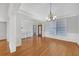 Bright dining room with hardwood floors and wainscoting at 2105 Rock Ct, Loganville, GA 30052