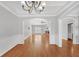 Formal dining room featuring hardwood floors and arched entryways at 2105 Rock Ct, Loganville, GA 30052