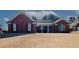 Brick home with covered porch and large windows at 2105 Rock Ct, Loganville, GA 30052