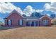 Brick ranch home with a large front yard at 2105 Rock Ct, Loganville, GA 30052
